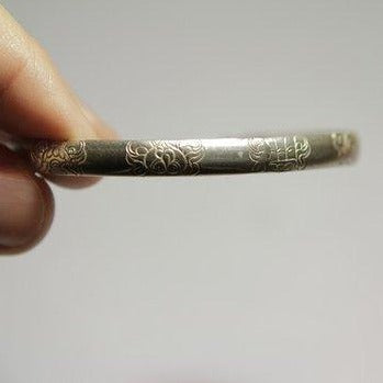 Rigid bracelet decorated in silver