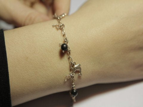 Bronze bracelet with dolphins