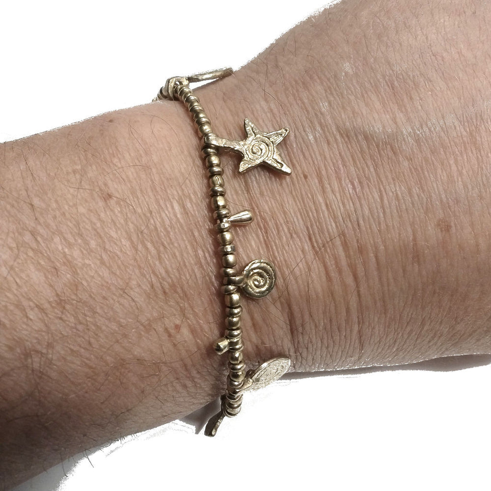 Bracciale artigianale in ottone STELLA SPIRALE FIORI | Bracciale ottone