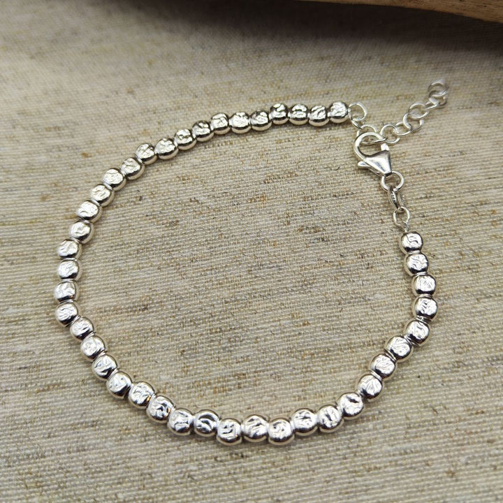 BRACCIALE ARGENTO a tubi piatti martellati grandi - JUSSA
