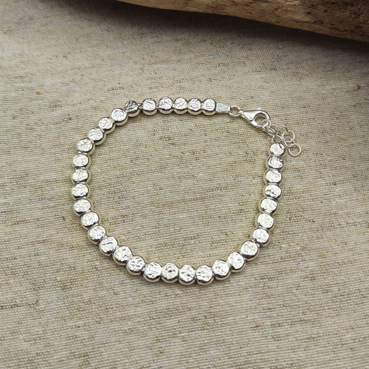BRACCIALE ARGENTO a tubi piatti martellati grandi - JUSSA