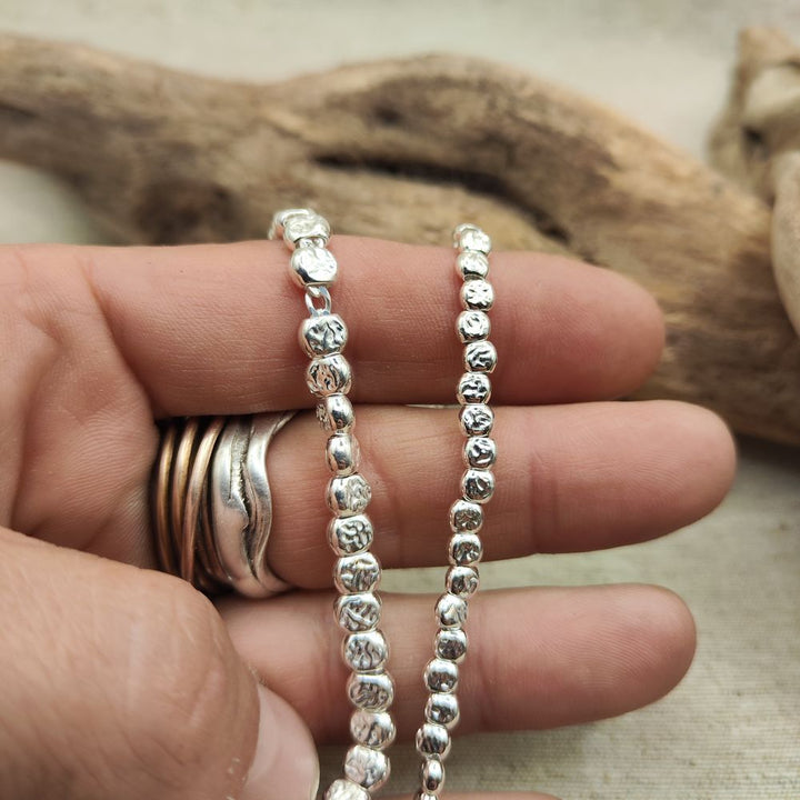 BRACCIALE ARGENTO a tubi piatti martellati grandi - JUSSA