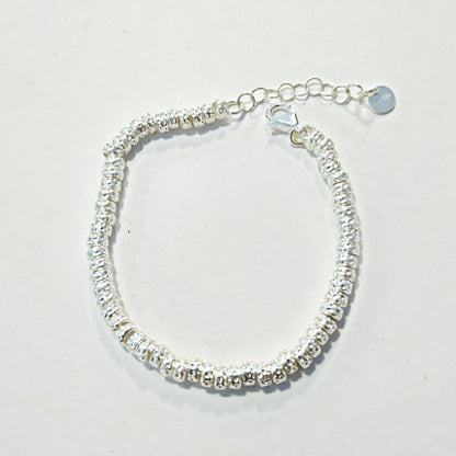 BRACCIALE ARGENTO a dischi martellati piccoli – immagine1